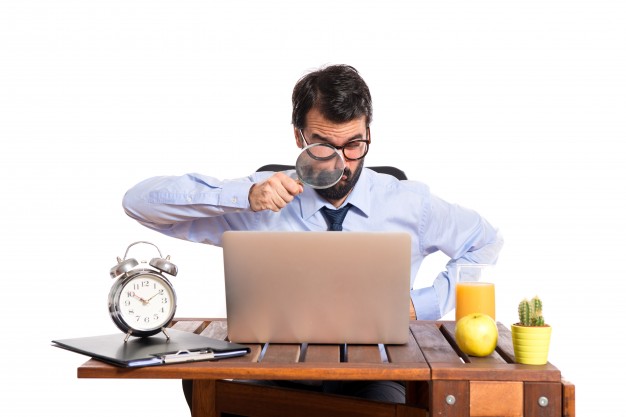 Businessman In His Office With Magnifying Glass 1368 4642
